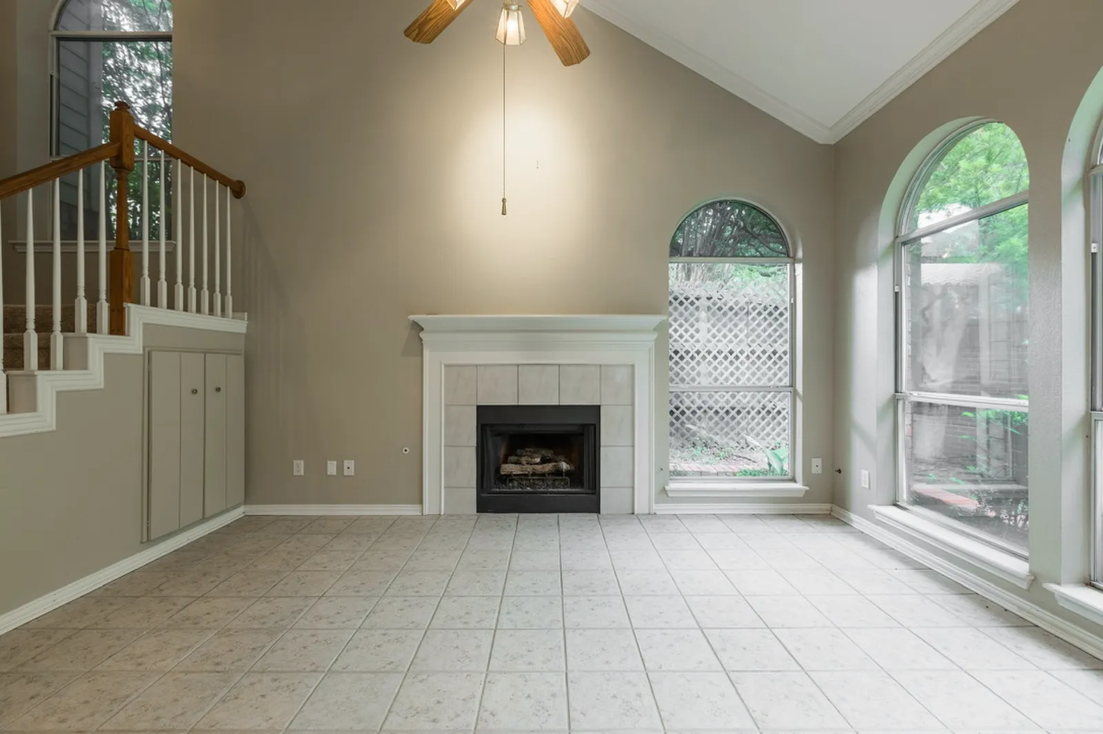 Azure Ln. living room in Addison before the renovation: beige tile and tan walls