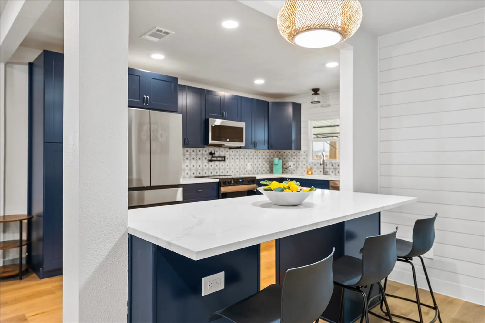 Sherman St. in McKinney kitchen after the renovation: navy cabinets and white shiplap