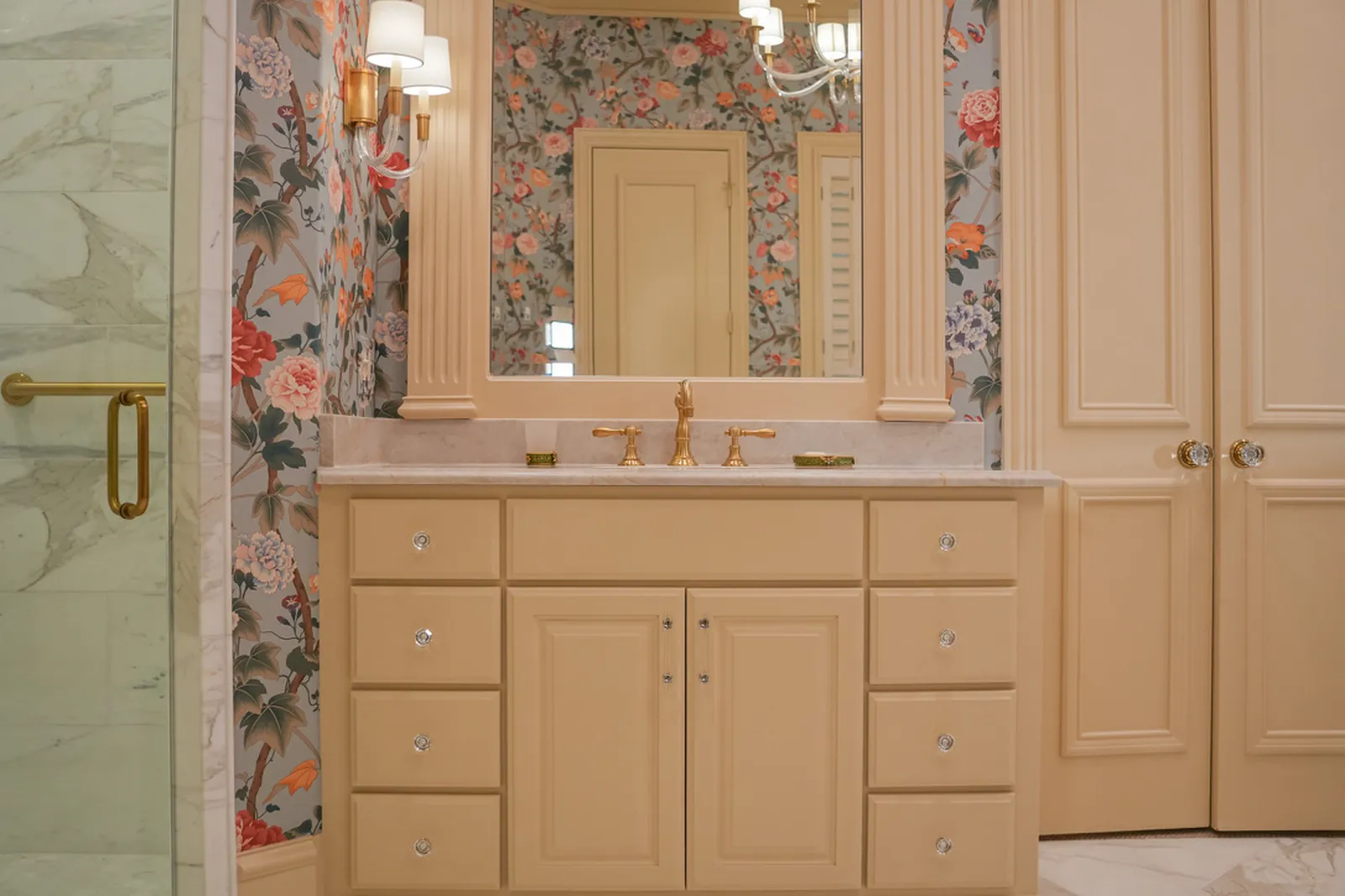 Vanity with marble counters and brass hardware at Shubert Ct. in Dallas